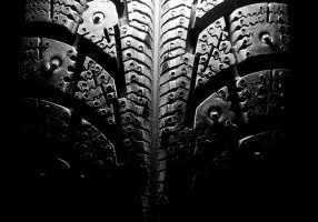 Close-up of new winter tire. In B/W